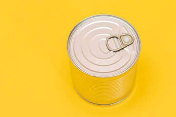 Tin Can on Yellow Background. Canned Food. Aluminum Can for Safe and Long Term Storage of Food. Steel Sealed Food Storage Container