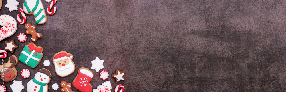 Poster fun colorful christmas cookie corner border on a dark stone banner background with copy space. above