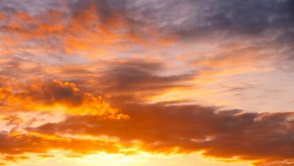 Beautiful colorful fluffy clouds in golden sunset