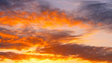 Beautiful colorful fluffy clouds in golden sunset