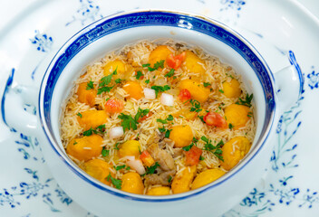 Traditional Brazilian dish rice, chicken and pequi (caryocar brasileinse) known as galinhada goiana