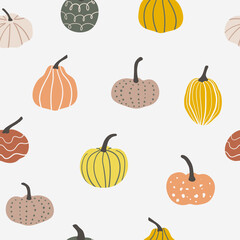 Pastel colored seamless pattern with pumpkins