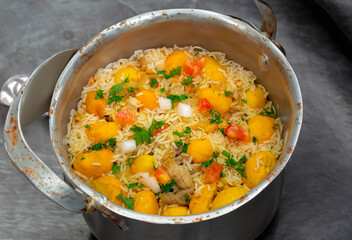 Traditional Brazilian dish rice, chicken and pequi (caryocar brasileinse) known as galinhada goiana