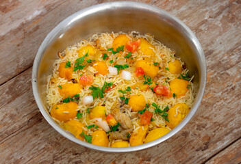 Traditional Brazilian dish rice, chicken and pequi (caryocar brasileinse) known as galinhada goiana