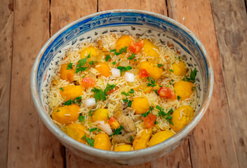 Traditional Brazilian dish rice, chicken and pequi (caryocar brasileinse) known as galinhada goiana