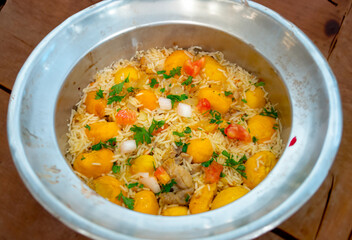 Traditional Brazilian dish rice, chicken and pequi (caryocar brasileinse) known as galinhada goiana