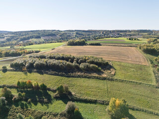 Aerial view of lush green fields and meadows showcasing the beauty of nature in a peaceful landscape