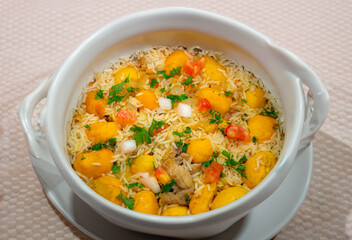 Traditional Brazilian dish rice, chicken and pequi (caryocar brasileinse) known as galinhada goiana