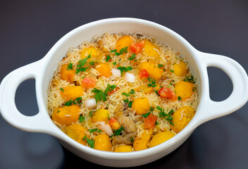 Traditional Brazilian dish rice, chicken and pequi (caryocar brasileinse) known as galinhada goiana