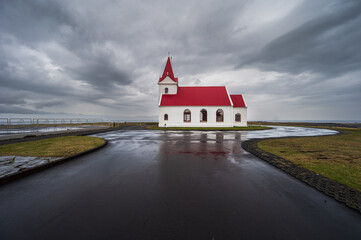 Fototapeta premium ingjaldsholskirkja church with a cloudy sky in the background on the Snaefellsness Peninsula, Iceland