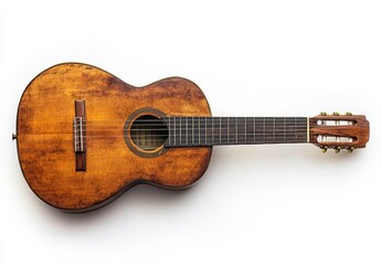 Obraz premium A worn wooden acoustic guitar on a white background.
