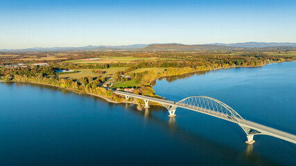 Aerial view of Lake Champlain Bridge, spanning the serene lake and connecting Crown Point, New York to Vermont.