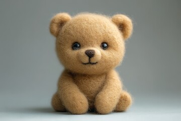 Obraz premium Adorable handmade bear on a gray background