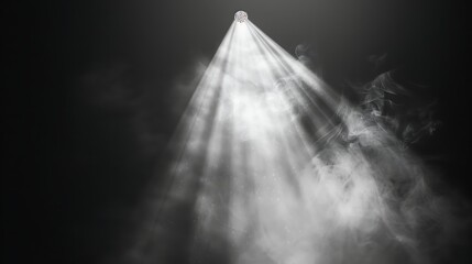 Spotlight in a dark room with smoke and rays of light.