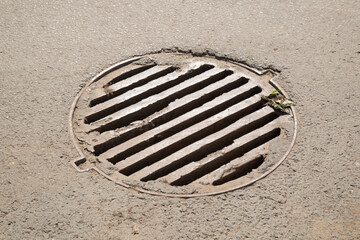 Storm sewer system on the city street. Sewage treatment.
