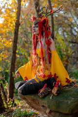 Deer girl in the autumn forest