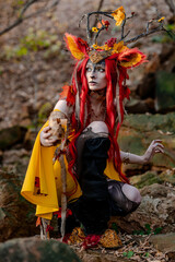 Deer girl in the autumn forest