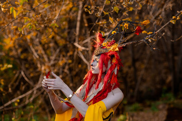 Deer girl in the autumn forest