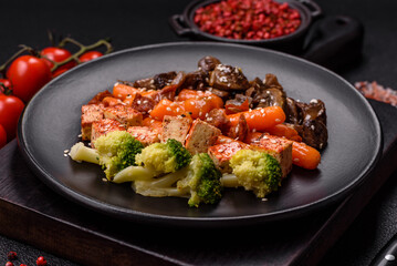 Colorful vegan vegetarian dish consists of tofu, broccoli, quinoa, mushrooms