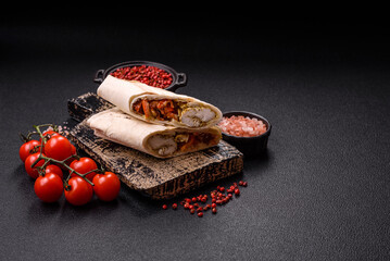 Roll with pita, meat, tomatoes, cheese, sauce, salt and spices