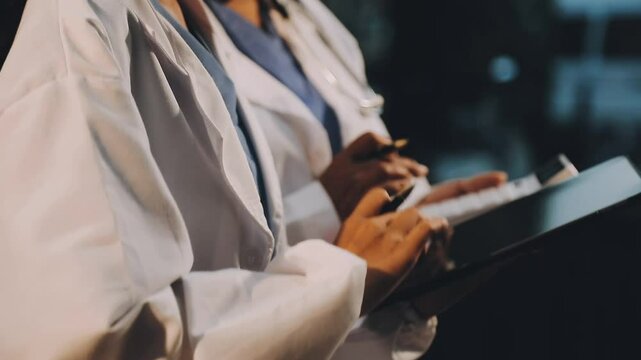 A diverse group of healthcare professionals, including doctors, nurses, and specialists, engaging in a collaborative meeting to discuss medical cases and share expertise in a hospital