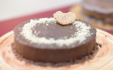 Chocolate Cake with Heart-Shaped Cookie Decoration on Wooden Board