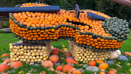 Pumpkin Crafts at fall harvest festival. Halloween farmers market. Concept of seasonal produce, country market and festive fall decorations.
