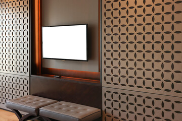 Tv set mounted on wall and bench in room