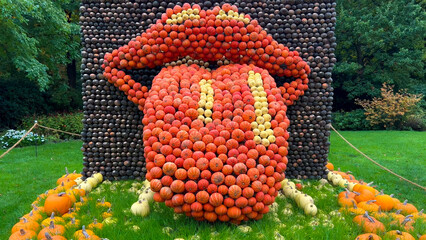 Pumpkin Crafts at fall harvest festival. Halloween farmers market. Concept of seasonal produce, country market and festive fall decorations.