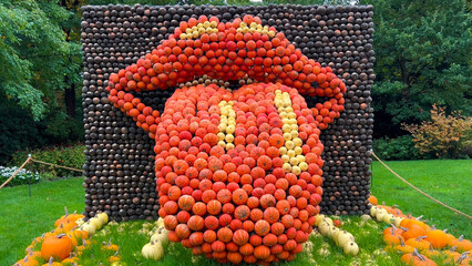 Pumpkin Crafts at fall harvest festival. Halloween farmers market. Concept of seasonal produce, country market and festive fall decorations.