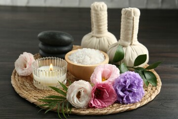 Spa composition with massage bags on wooden table