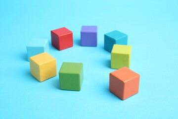 Obraz premium Many colorful cubes on light blue background