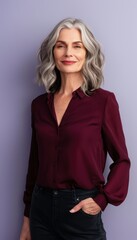 Confident Mature Woman with Silver Hair in Dark Red Blouse Against Purple Background for Portrait Use