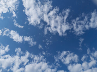 Beautiful blue sky with fluffy white clouds, creating a serene and peaceful atmosphere for relaxation and inspiration.