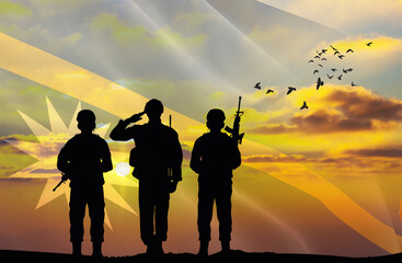 Silhouettes of soldiers with a background of the Nauru flag and a sunset or sunrise. Concept of national holidays. Commemoration Day.