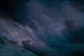 Dark storm clouds gather, creating a dramatic and moody sky ambiance.