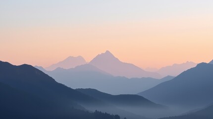 Sunrise over serene mountain ranges with misty valleys in the early morning light captured in a tranquil landscape