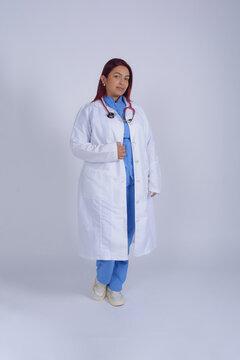 Young latina female doctor, full body vertical portrait