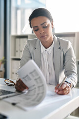 Office, businesswoman and reading with paperwork for signature, approval and agreement for...