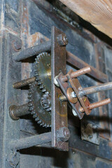 Church clockwork. The gear mechanism of a large old tower clock. Antique large clock mechanism with gears and cogs after restoration