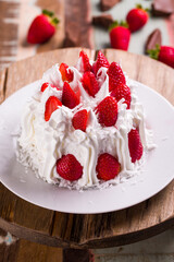 Delicious Strawberry Cream Cake with Whipped Topping and Fresh Berries