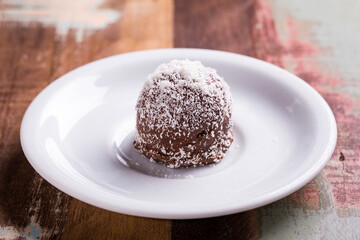 Delicious Chocolate Dessert Topped with Coconut on Plate
