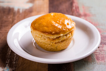 Delicious Golden Empada on White Plate