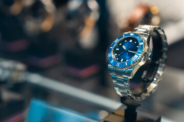 A wristwatch in a display case