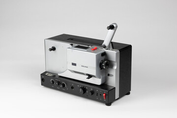 Obraz premium 1960s Vintage Analog Film Projector with Sound and Reel Handle, Super 8 and 16mm Formats, Isolated on White Background