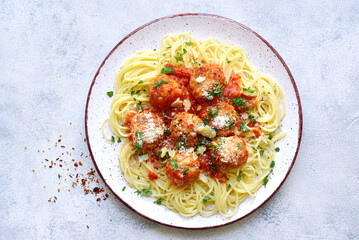 Pasta spaghetti with meat ball in tomato sauce on a plate . Top view with copy space.