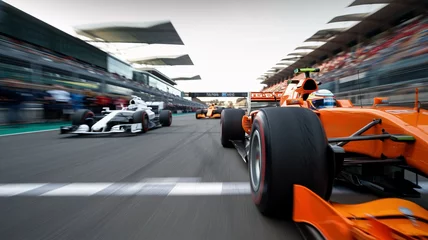  Formula 1 Race Start:  A thrilling view of Formula 1 cars speeding off the starting grid, capturing the raw power and adrenaline of motorsport. © GS-Studio
