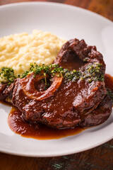 Savory Braised Beef Osso Buco with Creamy Risotto on Plate