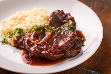 Delicious Osso Buco with Creamy Risotto on White Plate