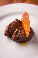 Gourmet Chocolate Dessert with Crisp Garnish on Elegant Plate